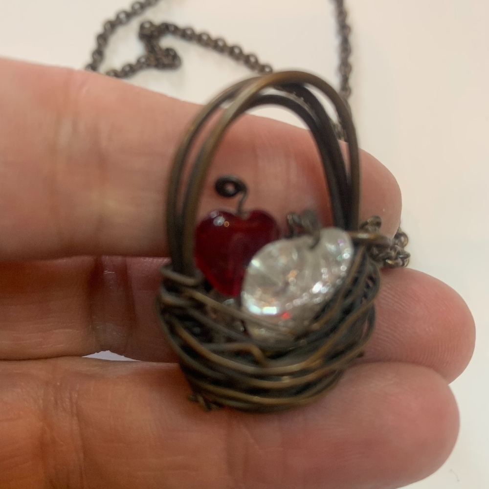 necklace with wired basket filled with heart beads